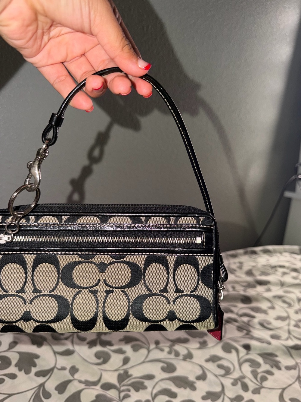 Black and Beige Signature-Pattern Wristlet Bag